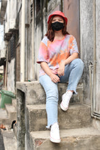 Load image into Gallery viewer, Sunset Paradise Tie-Dye Tee inspired by the vibrant colours of the sunset like orange, blue, purple and pink.
